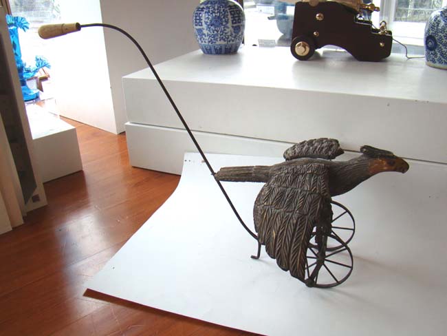 A late Victorian carved wooden spread wing eagle push toy — image 7